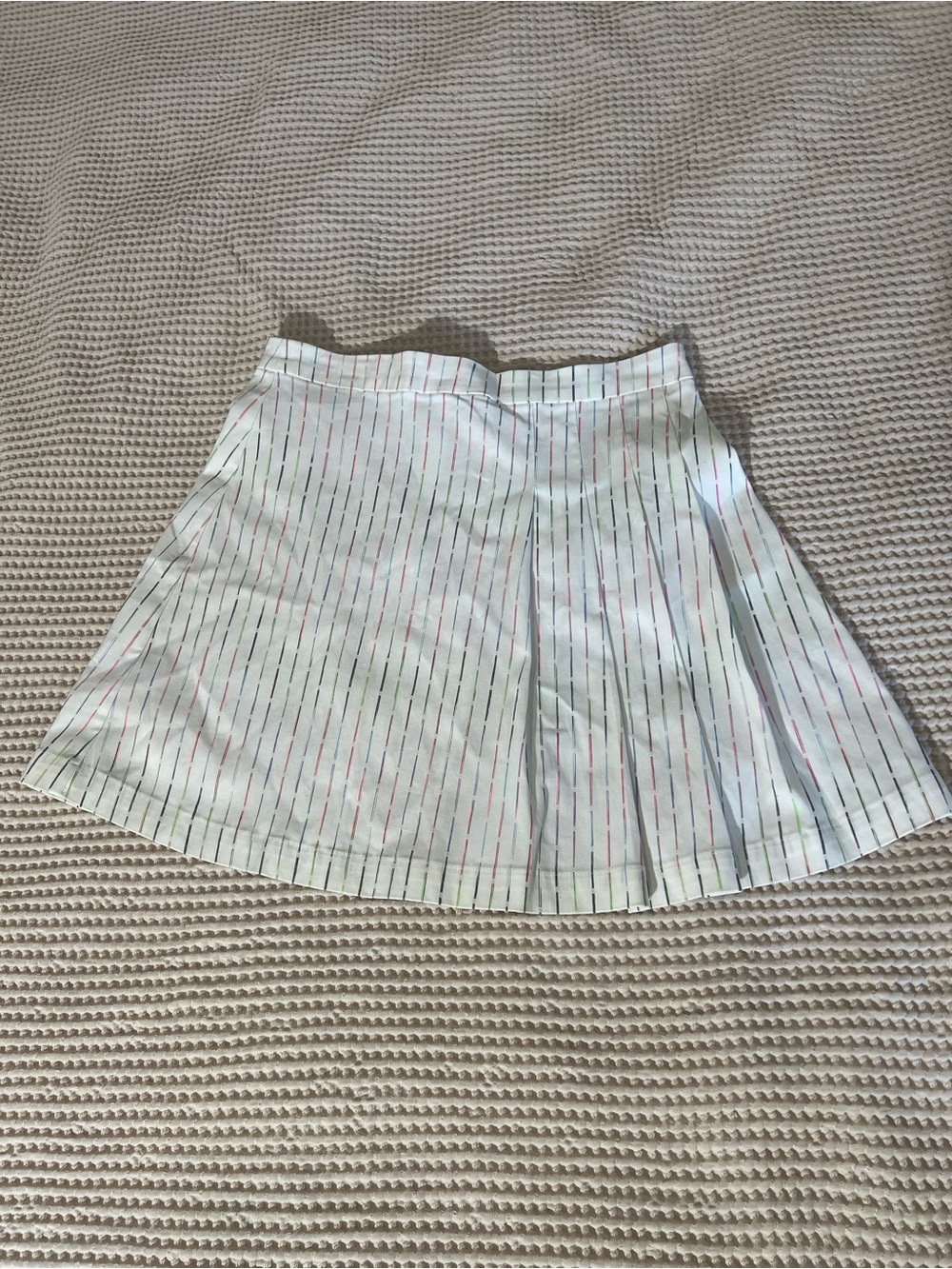 BCBG White Pleated Mini Skirt with Subtle Multi-Color Pinstripes